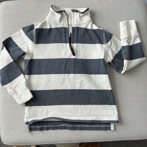 Gray and cream colored zip sweater